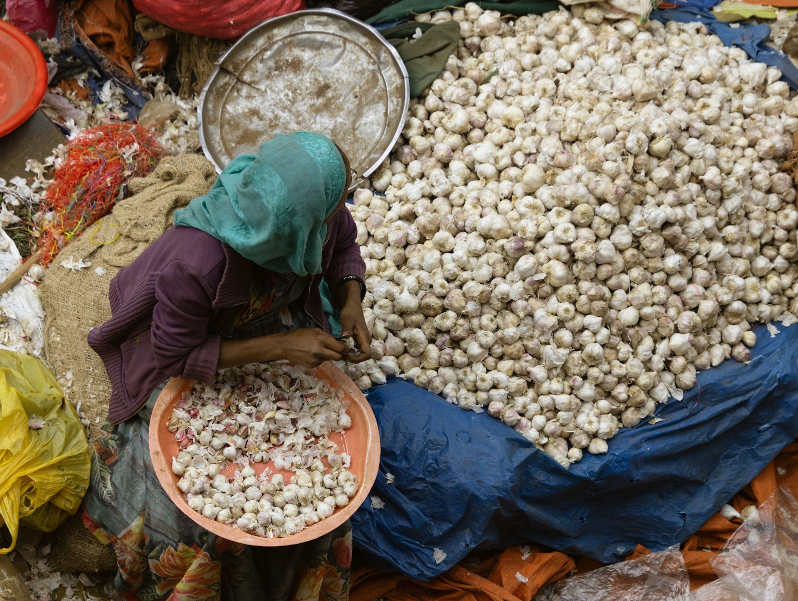 A market vendor sorting fresh produce in Africa